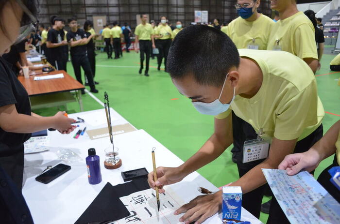 New students participate in a calligraphy experience.